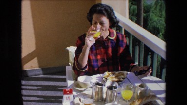 1971: a woman sitting at the dining table and drinking juice ALGERIA
