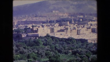 1971: a large city in the lap of a mountain surrounded by rich greenery ALGERIA