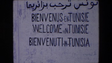 1971: a sign written in various languages that states welcome in tunisia ALGERIA