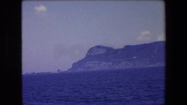 1971: riding a boat in the mountains at the sea SPAIN