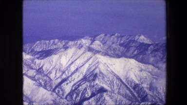 1967: a view from above of a beautiful snow covered mountain range AMSTERDAM