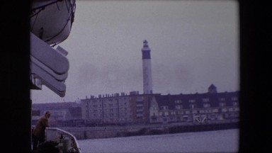 1967: a cloudy hazy view of a city built on a river filled with beautiful