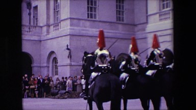 1967: army troops riding horse people standing castle watching flags