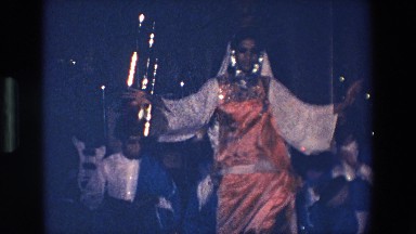 1967: traditional dancer performs in front of small group of musicians. PALERMO