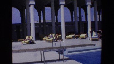 1967: Swimming Pool at Luxury Hotel Under Blue Skies