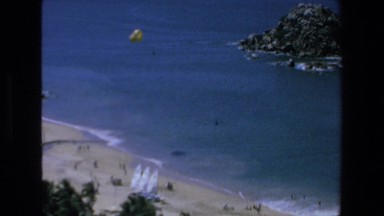 1972: A Person Parasailing in the Blue Sky Mazatlan Mexico