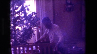 1981: man removing decorations from christmas tree HOLLYWOOD CALIFORNIA