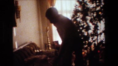 1981: man admiring his new christmas present LANSING MICHIGAN