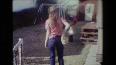 1981: The Little Kid Stands Confused Beside a Wooden Structure