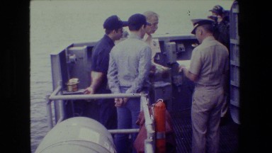 1981: policeman checking documents on boat SAN DIEGO NAVAL BASE