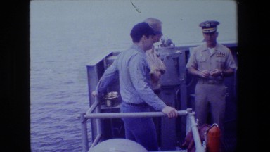 1981: men talking with a navy officer on a ship or aircraft carrier SAN DIEGO