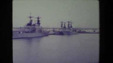 1981: a military man looking out over dozens of naval ships in the water