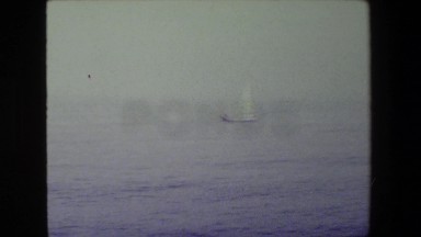 1981: in the distance, we see a single sailboat. SAN DIEGO NAVAL BASE