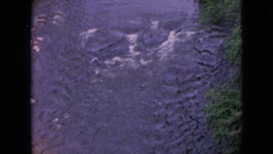 1964: Aerial View of Niagara Falls Canada with Roaring Waterfall and Foamy Spray