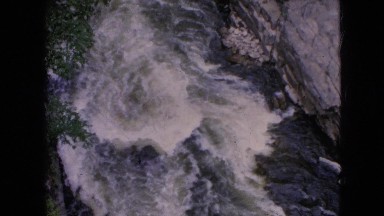 1964: dizzying view of white water churning through the river