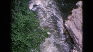 1964: view of a water water river rampaging through