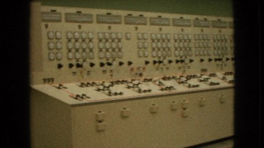 1964: cream color long operational control unit in a lab with two men