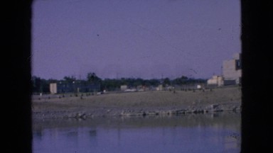 1964: a factory or industrial looking buildings on a large body of water NIAGRA