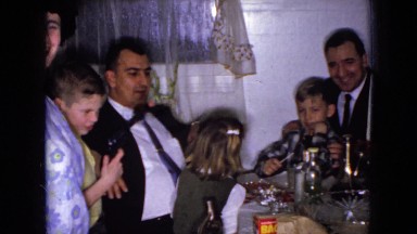 1965: family and friends gathered around the dinner table WELLSBURG IOWA