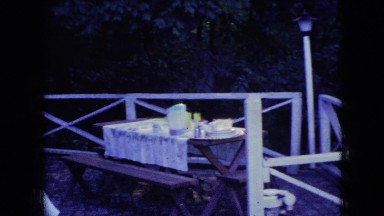 1965: man sweeping floor child standing watching table food kept pulling machine
