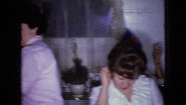 1965: group of people smoking, drinking and enjoying around a table WELLSBURG
