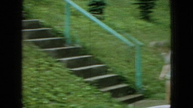 1965: cute little girls playing park sprinkling water sliding stairs trees