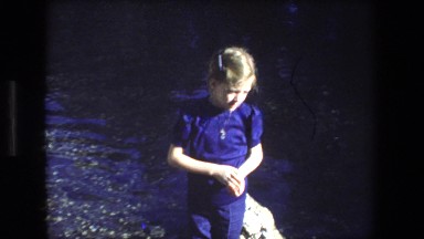 1972: girl standing by lake near monument ISRAEL