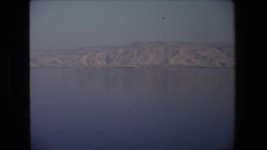 1972: a vast and calm lake with blue water and surrounded by mountain ISRAEL