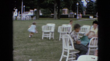 1967: park outing boys girls ladies women chairs tables grass trees lampstands