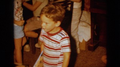 1967: people having a home party surrounded by boxes IOWA