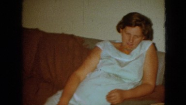 1967: mother calmly telling her daughter to wave for the camera
