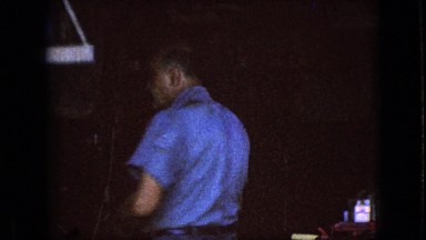 1967: mechanic picking something up in a tire shop IOWA