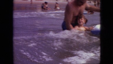 1968: men women children waving in water walking in water having fun MISSOURI
