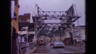 1968: car driving over a bridge in a construction site. MISSOURI