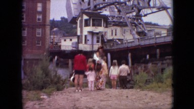 1968: family looking pointing drawbridge lowering 4-door sedan