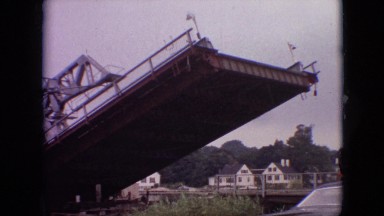 1968: drawbridge lowering car flags children parents river