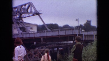 1968: people standing watching crane destroy house huge unique sight MISSOURI