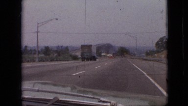 1968: car moving fast on highway truck ahead MISSOURI