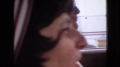 1968: two people taking a road trip across a bridge into a city in a vehicle