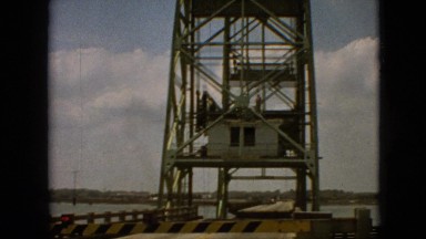 1968: huge tower stands on the shore of river up in the sky MISSOURI