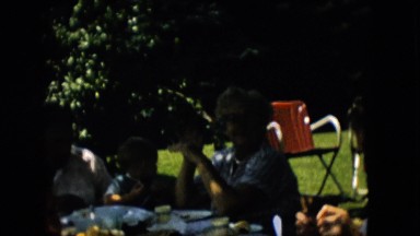 1957: a family is sitting around a table to have food outdoor PENNSYLVANIA