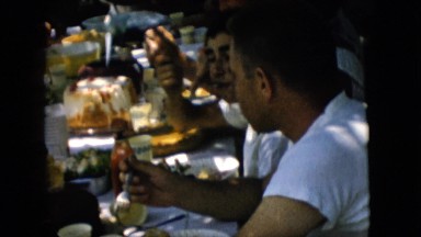 1957: friends and family eating around a picnic table PENNSYLVANIA