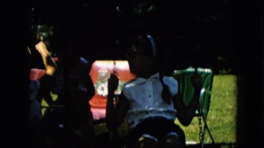 1957: children playing on their swing set. PENNSYLVANIA
