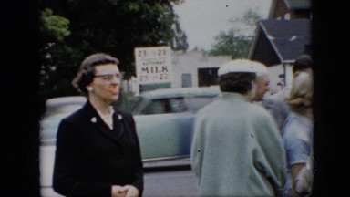 1957: a gathering in the neighborhood with cars going by PENNSYLVANIA