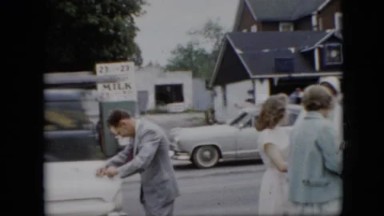 1957: busy street people walking along viewing PENNSYLVANIA