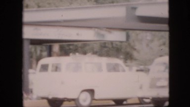 1958: Cars Parked by Large Colorful Building in Pennsylvania