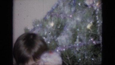 1964: christmas morning in the 1960s with children waving and excited