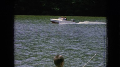 1964: motorboat traveling across the lake on a summer's day. PHILADELPHIA