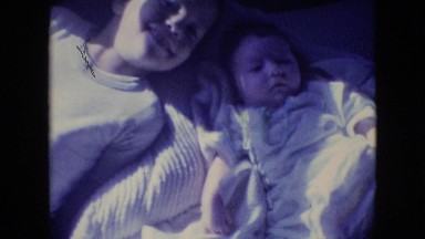 1964: in bed with baby sibling PHILADELPHIA PENNSYLVANIA