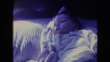 1964: little baby laying down on the couch. PHILADELPHIA PENNSYLVANIA